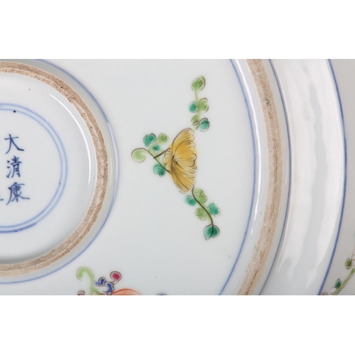 17 - A Chinese famille rose charger, painted to the centre with water fowl amongst lily pads with a wavy ... 