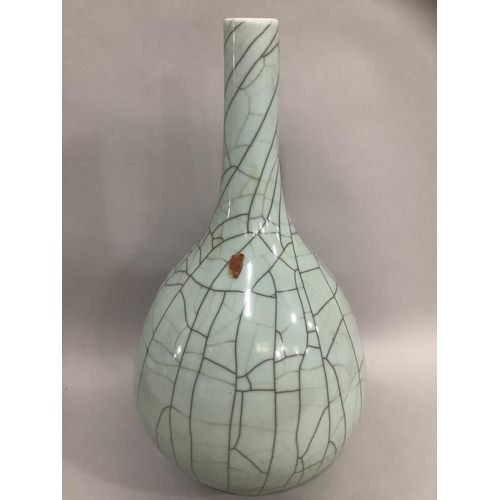 10 - A large Chinese celadon crackle glaze vase, remnants of wax seal attached, 57cm high