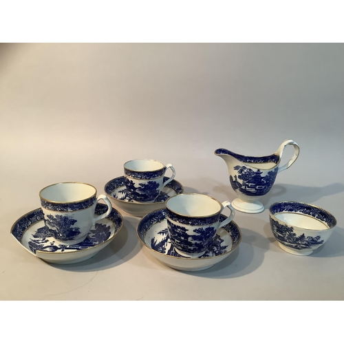 12 - An early 19th century coffee set in blue and white pattern with gilt comprising three cups, three pl... 