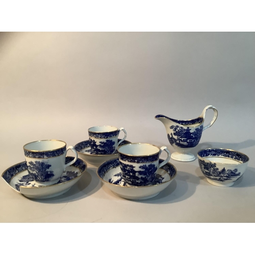 12 - An early 19th century coffee set in blue and white pattern with gilt comprising three cups, three pl... 