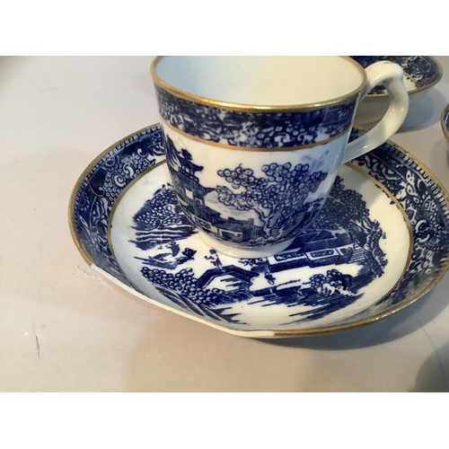 12 - An early 19th century coffee set in blue and white pattern with gilt comprising three cups, three pl... 