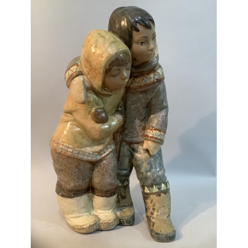 2 - A large Lladro Gres group 'Inuit boy and girl' no. 2038 designed by Juan Huerta, with Lladro mark to... 