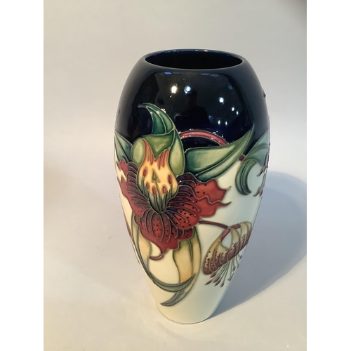 20 - A Moorcroft pottery vase of Anna Lily design, ovoid, impressed mark and painted 98 to underside, 8.7... 