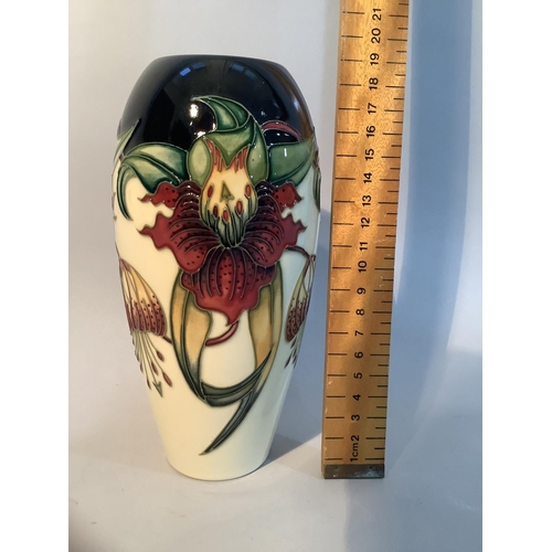 20 - A Moorcroft pottery vase of Anna Lily design, ovoid, impressed mark and painted 98 to underside, 8.7... 