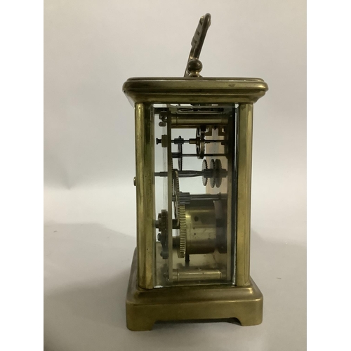 32 - A brass carriage clock by Snow and Ashworth of Harrogate with a French movement, white enamel dial w... 