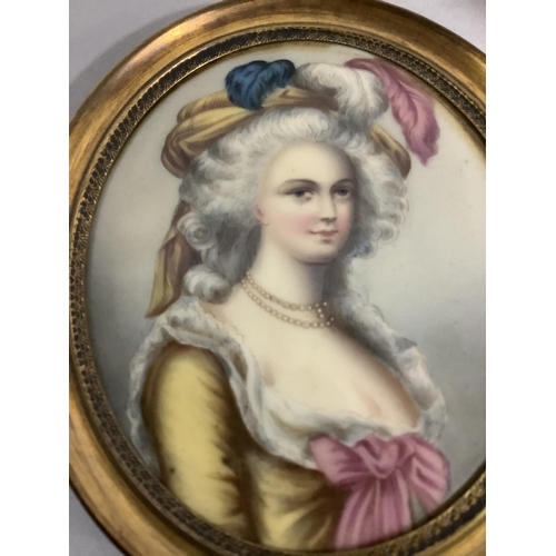 34 - A portrait miniature, possibly of Marie Antoinette, printed and painted on a gilt metal oval frame, ... 