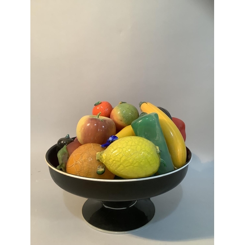 36 - An Italian amethyst glass pedestal dish with white rim line together with fruits in orange, yellow, ... 