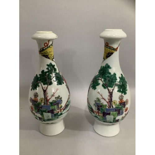 37 - A pair of Chinese famille rose vases, the bottle shaped bodies enamelled with merchantmen on horseba... 