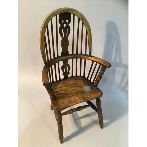 43 - An elm model of a high back Windsor armchair with H stretcher, 36.5cm high