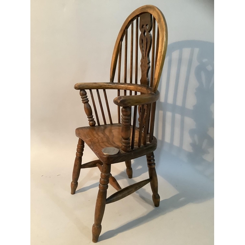 43 - An elm model of a high back Windsor armchair with H stretcher, 36.5cm high