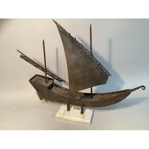 300 - F.J. Akers, sculpture of a cargo boat, in spelter on marble base, 46cm x 51cm