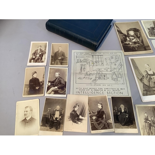 217 - A collection of Victorian and early 20th century portrait photographs, contained in a book shaped bo... 