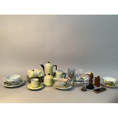 209 - A yellow lustre coffee set with black handles, two eggshell tea cups and saucers, moulded Staffordsh... 