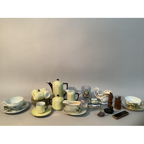 209 - A yellow lustre coffee set with black handles, two eggshell tea cups and saucers, moulded Staffordsh... 