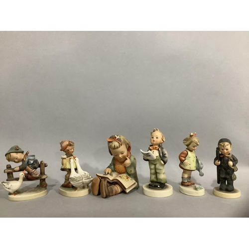 212 - Six Hummel figures including larger figure of a girl reading