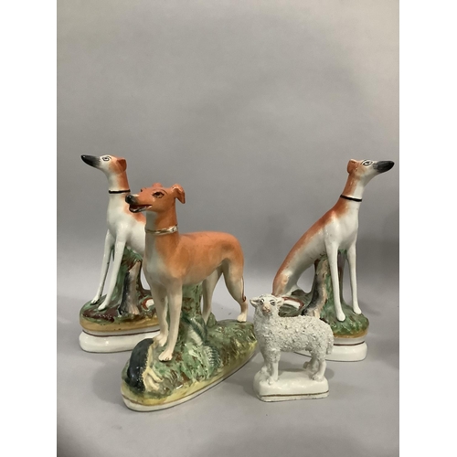 202 - A pair of 19th century Staffordshire greyhounds in seated positions 20.5cm high together with a late... 