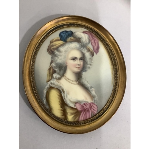 34 - A portrait miniature, possibly of Marie Antoinette, printed and painted on a gilt metal oval frame, ... 