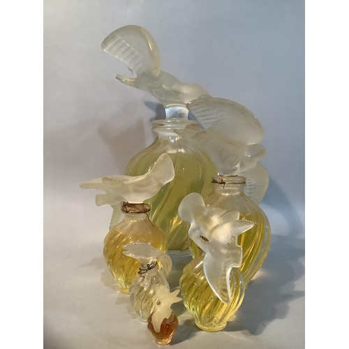 1 - A set of five Lalique factice perfume bottles for Nina Ricci L'Air du Temps of graduated size, the w... 