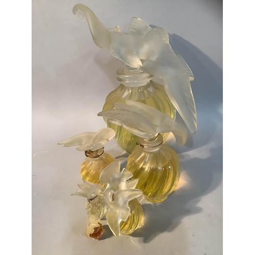 1 - A set of five Lalique factice perfume bottles for Nina Ricci L'Air du Temps of graduated size, the w... 