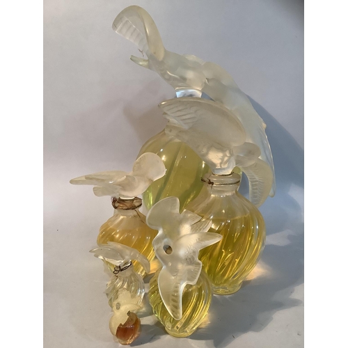 1 - A set of five Lalique factice perfume bottles for Nina Ricci L'Air du Temps of graduated size, the w... 