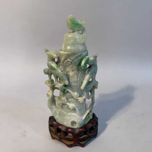 58 - A Chinese jade vase and cover carved as birds sitting in the branches of a peach tree, 16.5cn high o... 