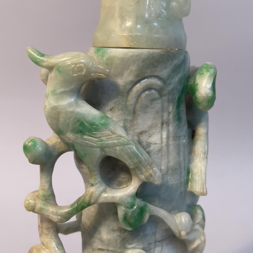 58 - A Chinese jade vase and cover carved as birds sitting in the branches of a peach tree, 16.5cn high o... 