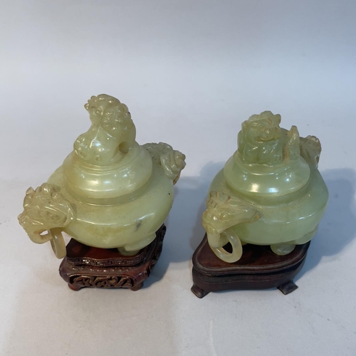 59 - Two matched Chinese soapstone vases, each having a domed cover with dog of Fo finial and twin animal... 