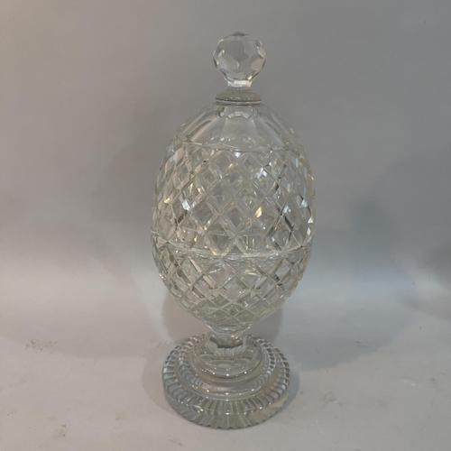 67 - A late 19th/early 20th century cut glass pedestal vase and cover with faceted knop finial and on ste... 