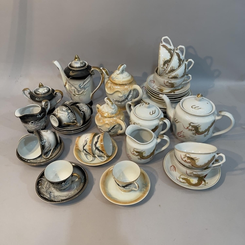 229 - A charcoal eggshell tea service for six with teapot, milk jug etc. two further tea sets moulded and ... 