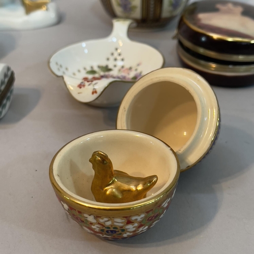 199 - A porcelain oval hinged trinket box with metal clasp painted with a portrait of a woman, a Limoges p... 