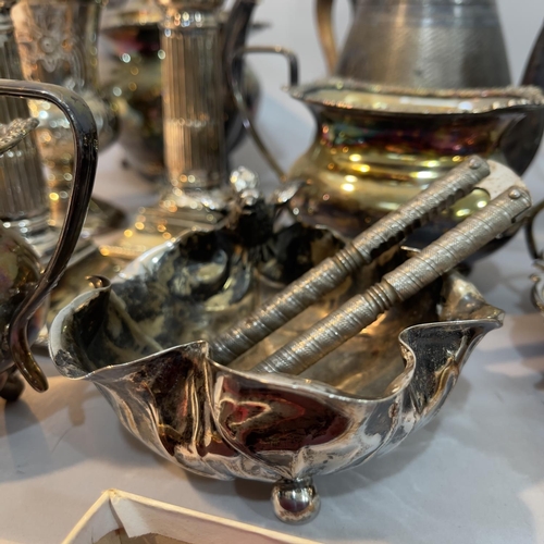 236 - A silver plate on copper tea service, another with moulded handles on paw feet, a pair of reeded can... 