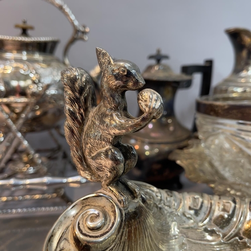 213 - A silver plated etched and fluted lidded ewer, a heavily moulded spirit kettle and stand, a moulded ... 