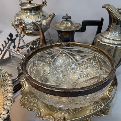 213 - A silver plated etched and fluted lidded ewer, a heavily moulded spirit kettle and stand, a moulded ... 