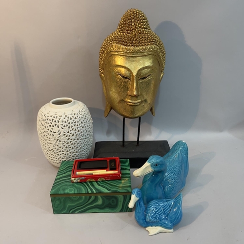 228 - A gilt buddha mask on stand, two Chinese turquoise glazed ducks, white reticulated lamp base (no fit... 