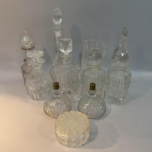 206 - Cut glass water jug, pair of spirit decanters and five further decanters, powder bowl and cover and ... 