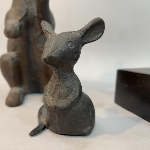 87B - A metal rabbit, a mouse and a dog's head on plinth