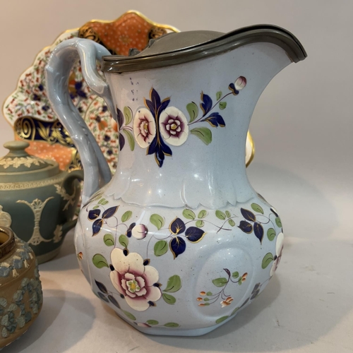 196 - A 19th century Ridgeway & Co blue pottery jug, pewter lidded, and enamelled with trailing flowers in... 