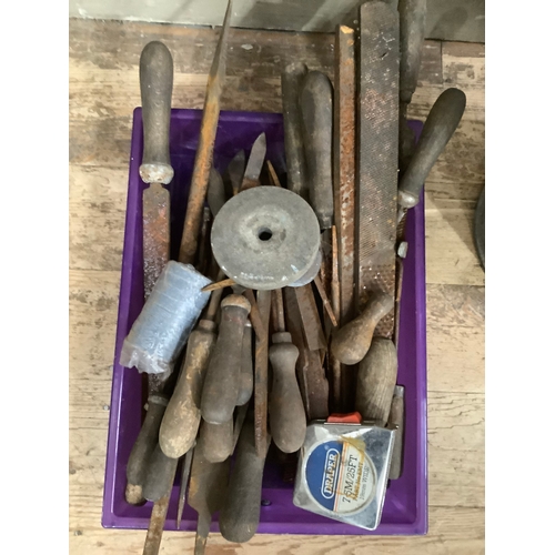 119 - A quantity of tools and a tin watering can