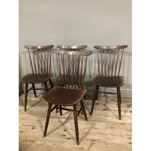 126 - A set of four spindle back Drevounia chairs, some with labels to base