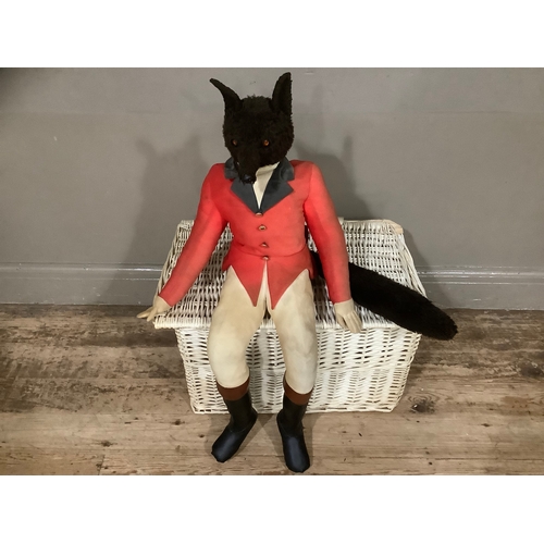 147 - A large stuffed figure of a huntsman fox together with a white wicker basket