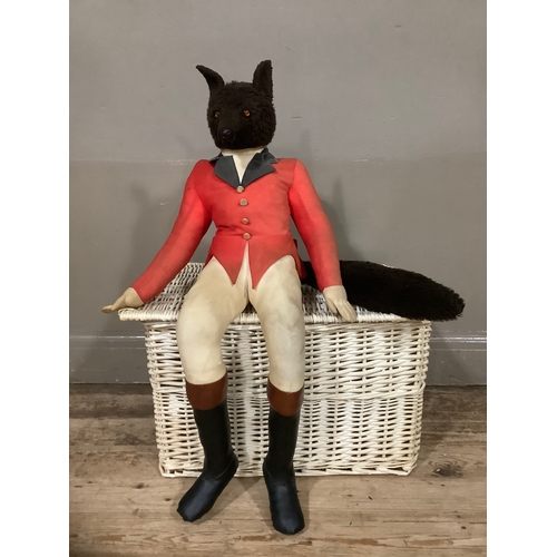 147 - A large stuffed figure of a huntsman fox together with a white wicker basket