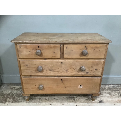 139B - A pine chest of two short above three long drawers on bun feet