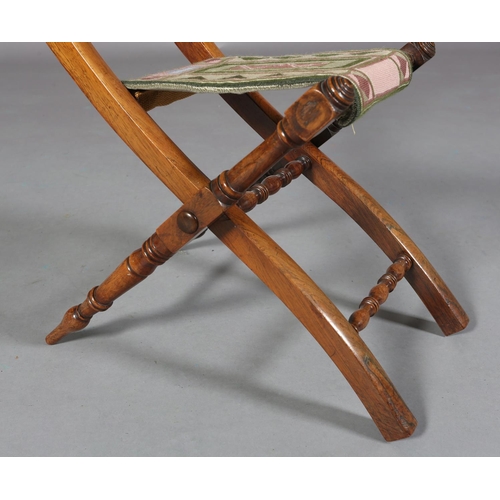 149 - A VICTORIAN CHILD'S ROSEWOOD FOLDING CHAIR WITH TRIPLE SPINDLE BAR BACK, slung needlework seat, on t... 