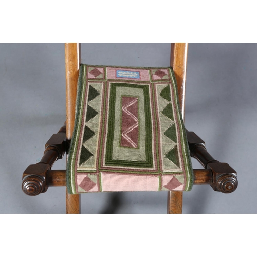 149 - A VICTORIAN CHILD'S ROSEWOOD FOLDING CHAIR WITH TRIPLE SPINDLE BAR BACK, slung needlework seat, on t... 