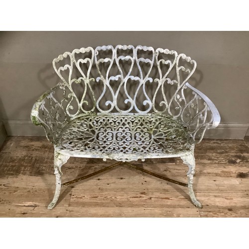 162 - A cast iron white painted ornate pierced garden bench