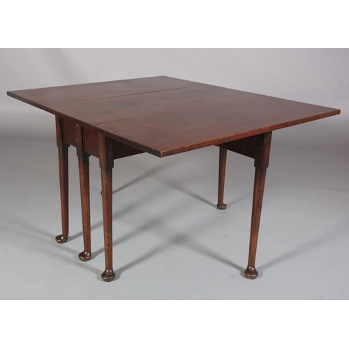 187 - A MID 18TH CENTURY MAHOGANY PEMBROKE SUPPER TABLE, having rectangular drop leaves, on six rounded le... 