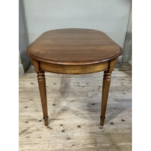 189 - A good modern cherry wood dining table of oval outline on turned legs, with extra leaf, 160cm with l... 