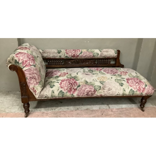 456 - A late Victorian stained beech chaise lounge with spindle back, upholstered in printed floral Heming... 