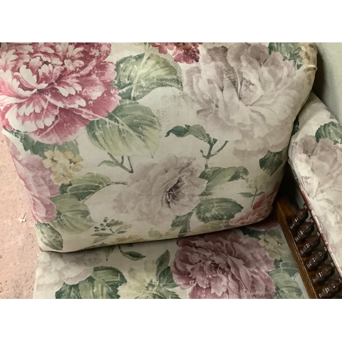 456 - A late Victorian stained beech chaise lounge with spindle back, upholstered in printed floral Heming... 