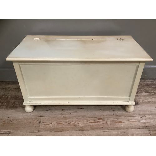 170 - A cream painted chest with hinged lid, 91cm wide